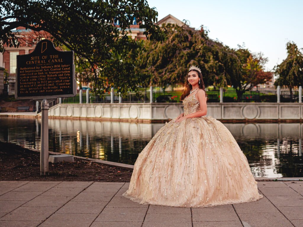 Quinceañera at the Indianapolis Canal standing next to the historic Central Canal sign