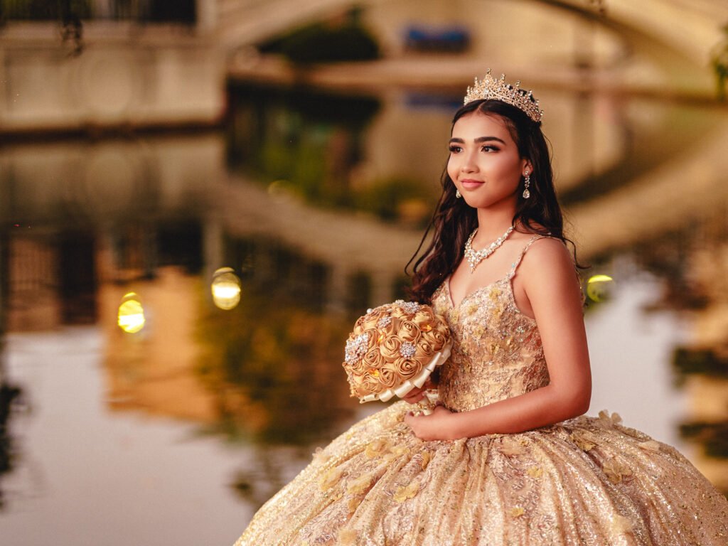 Close-up of a Quinceañera at the Indianapolis Canal posing with gold bouquet