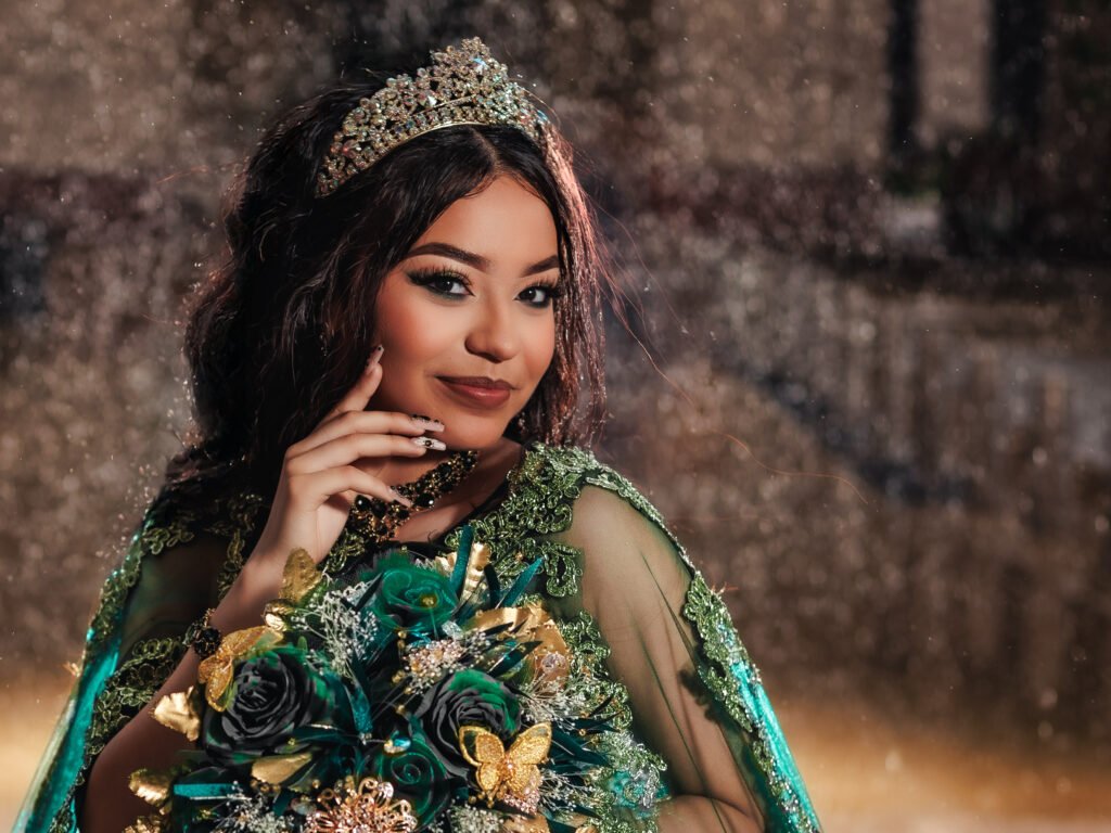 Smiling Quinceanera in emerald gown with moody lighting and fine art aesthetic at Indianapolis Capitol Building.