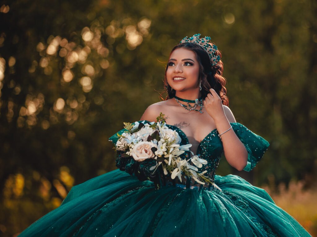 Smiling Quinceanera with tiara and bouquet, cinematic soft lighting and bokeh background at Coxhall Gardens