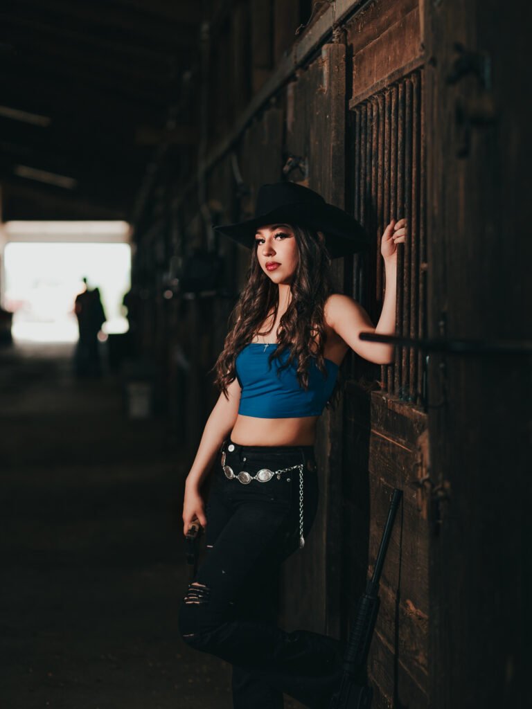 Artistic cowgirl birthday session with gun prop Indianapolis