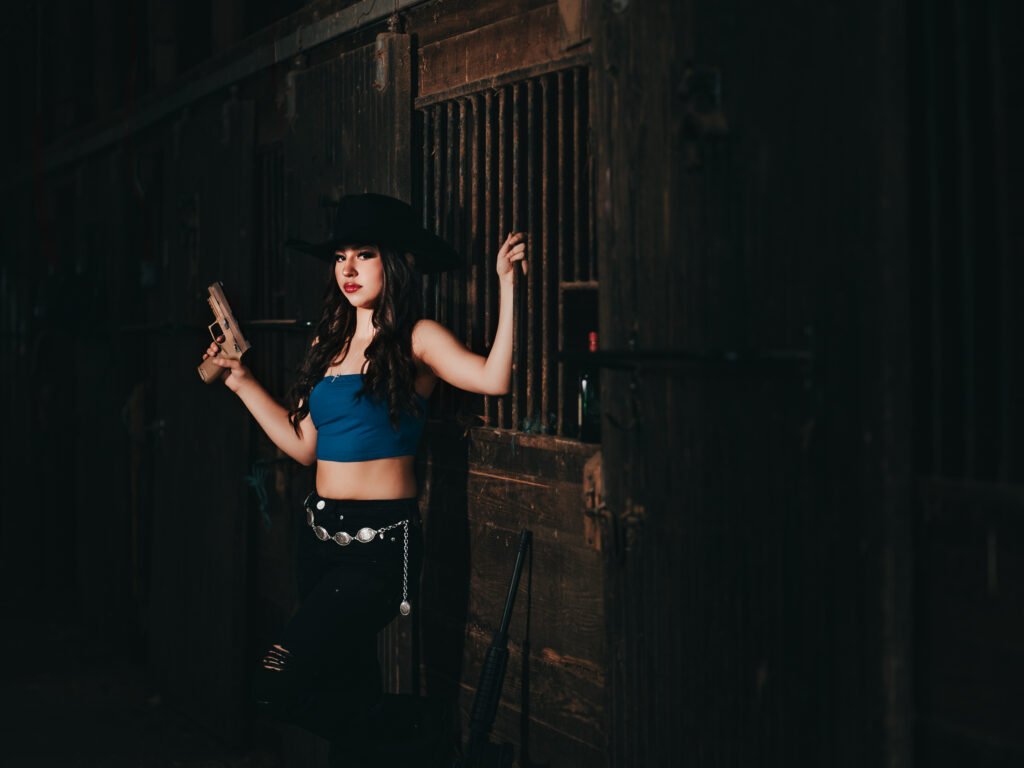 Artistic cowgirl birthday session with gun prop Indianapolis