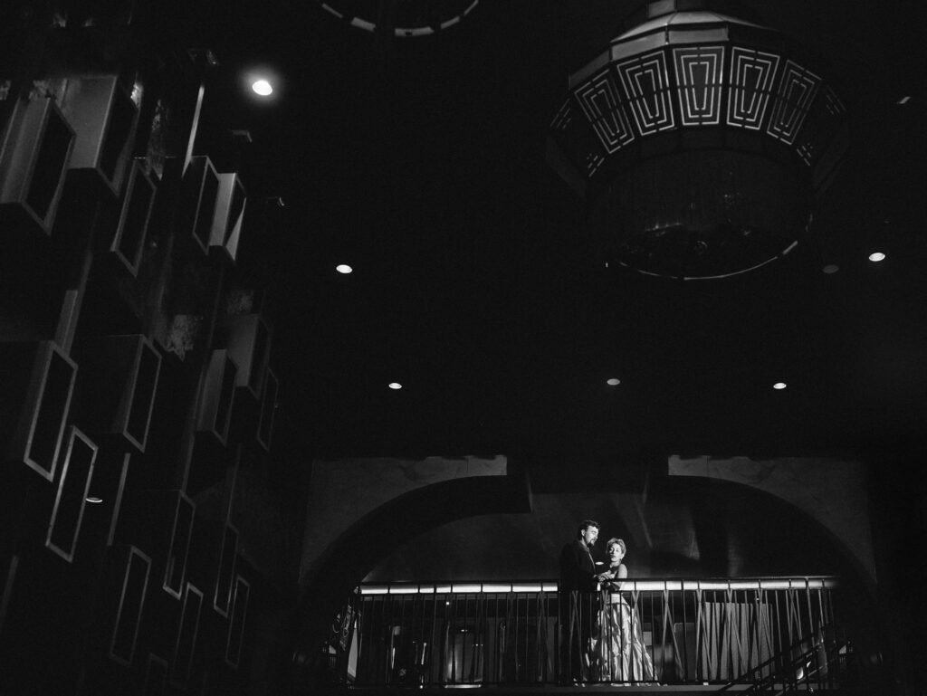 Black and white cinematic wedding photography Indianapolis balcony.